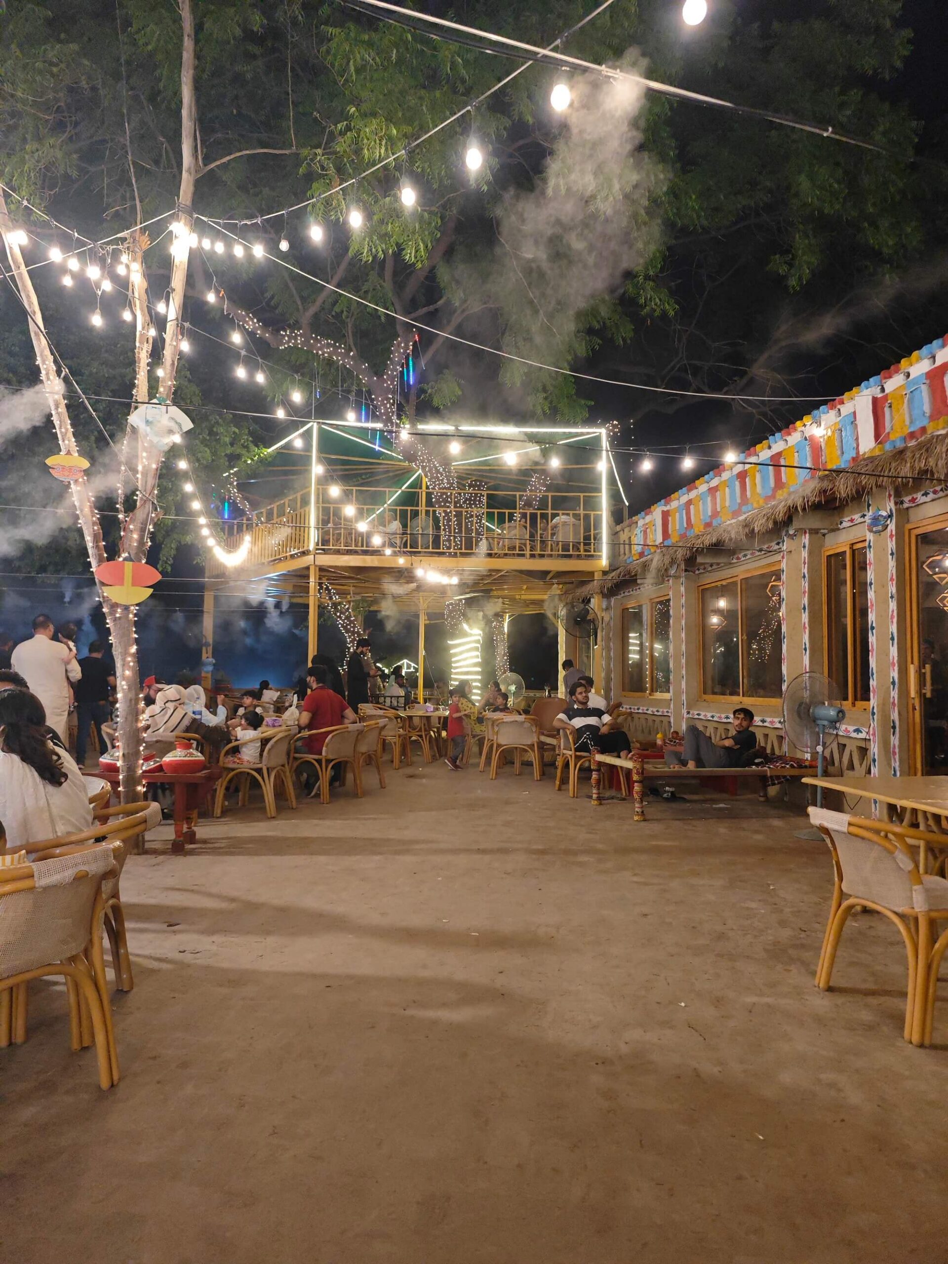 Organic Village Lahore illuminated at night